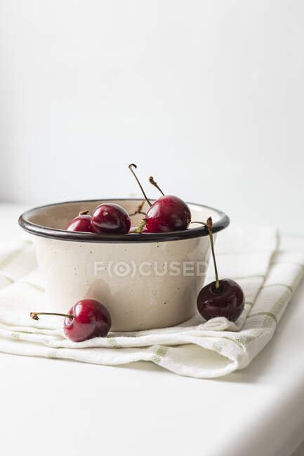 Cherries in an enamel pot — Stock Photo