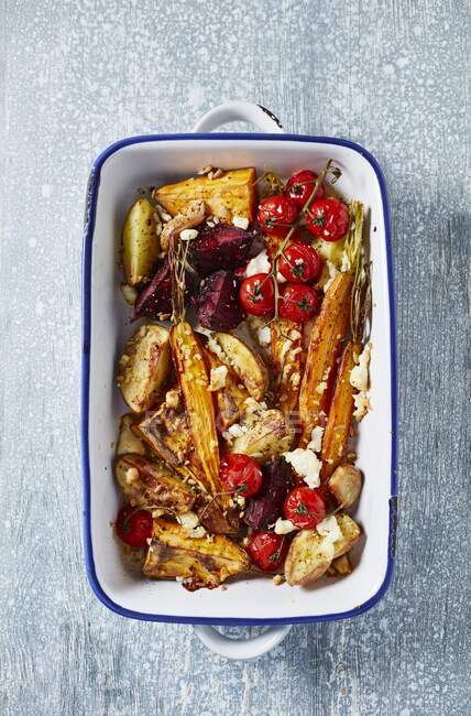 Oven baked vegetables with goat's cheese (top view) — Stock Photo
