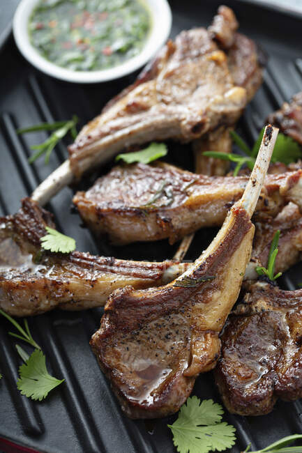Grilled lamb chops with chimichurri sauce — Stock Photo