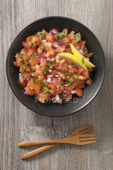 Tomato salsa with red onions — Stock Photo