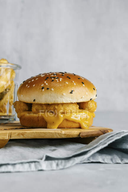 Chicken nuggets and mustard BBQ sauce burger — Stock Photo