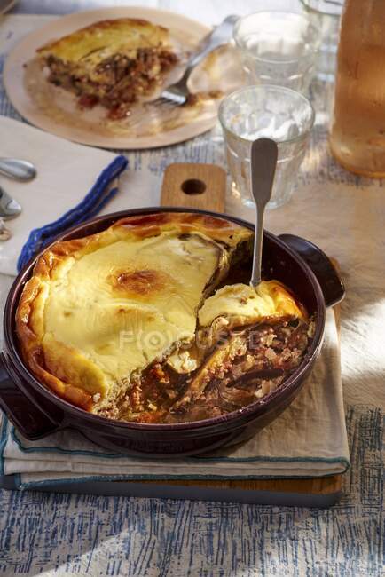 Moussaka in a round casserole dish — Stock Photo