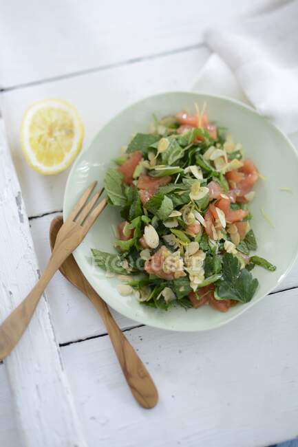 Tabbouleh with almond flakes — Stock Photo