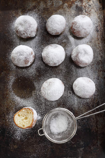 Mini donuts sprinkled with powdered sugar — Stock Photo