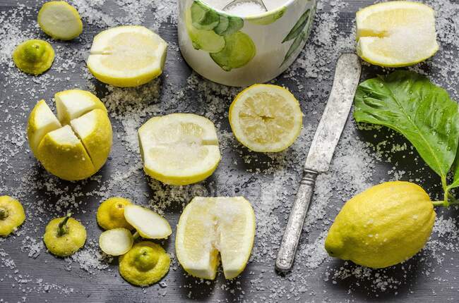 Lemons being soaked in salt — стокове фото