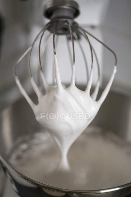 Whipped cream on a whisk — Stock Photo