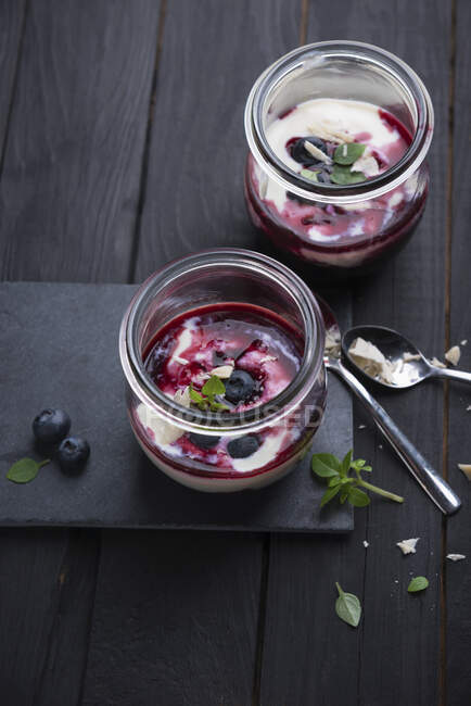 Almond yogurt with blueberry compote in a glass — Stock Photo