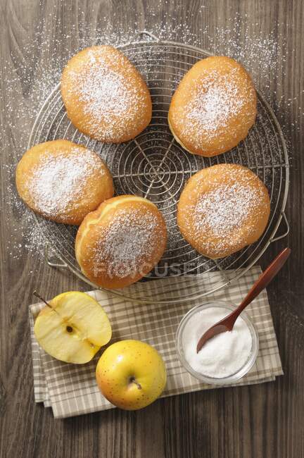 Apple doughnuts on a cooling rack — Stock Photo