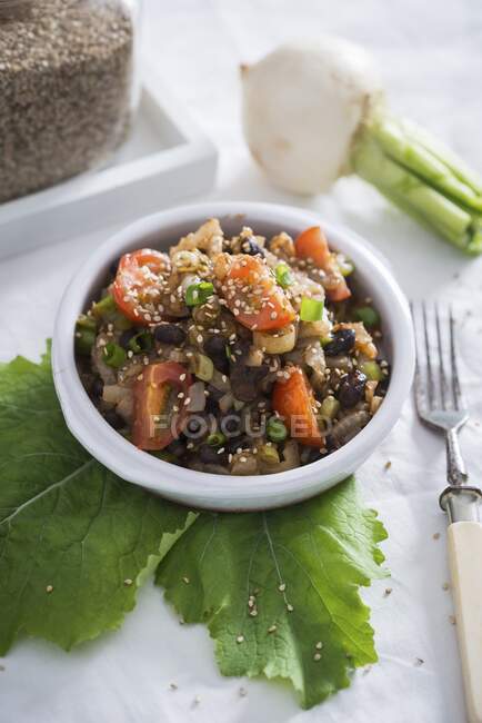 A warm salad with turnip and black beans (vegan) — Stock Photo