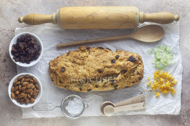 Christmas stollen with ingredients — Stock Photo