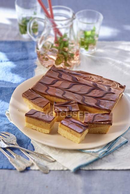 Shortbread with caramel and a chocolate glaze on a plate — Stock Photo