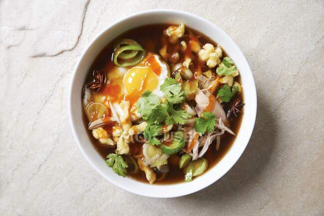 Spicy soup with chicken and eggs — Stock Photo