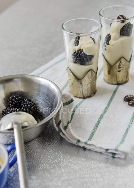 Whipped cream with blackberries — Stock Photo