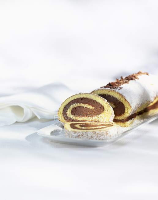 Close-up shot of delicious Chocolate sponge roll, sliced — Stock Photo