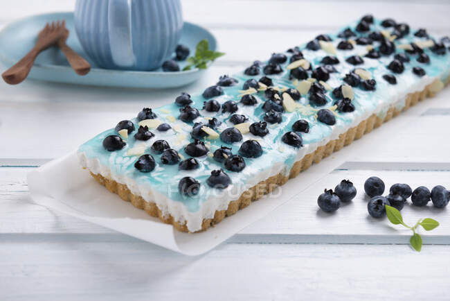 Vegan blueberry and cream cake with almonds — Stock Photo