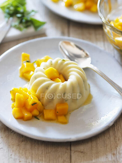 Panna cotta with mango compote — Stock Photo