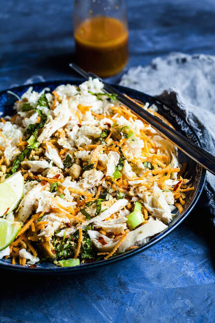 Vietnamese coleslaw with chicken and chopsticks, close up shot — Stock Photo