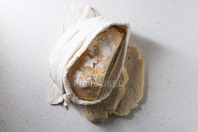 Spelled bread in a linen bag — Stock Photo