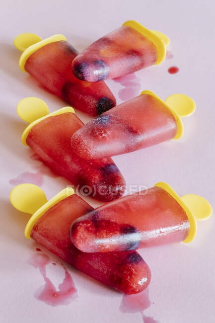 Frozen juice ice cream with raspberries and blueberries. — Stock Photo