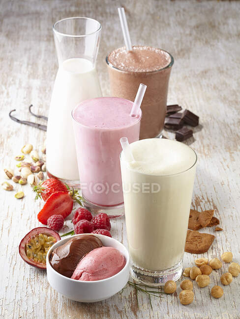 A chocolate milkshake, a strawberry milkshake and a vanilla milkshake — Stock Photo