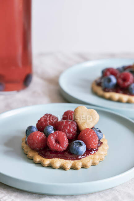 Open tart with jam and berries. — Stock Photo