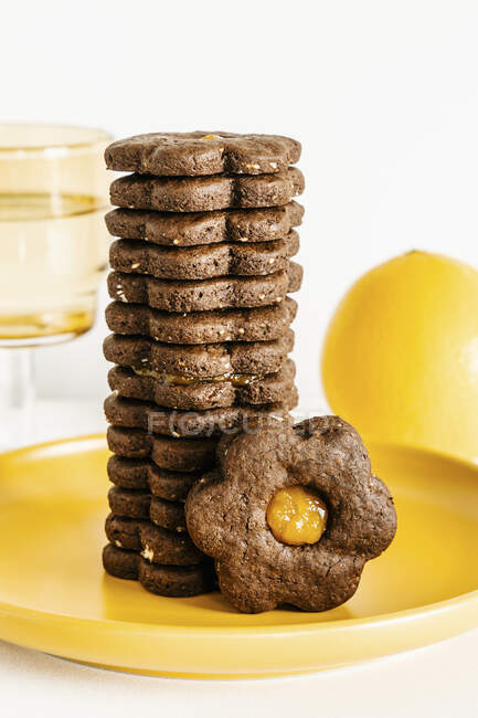 Dark chocolate and orange cookies with jam — Stock Photo