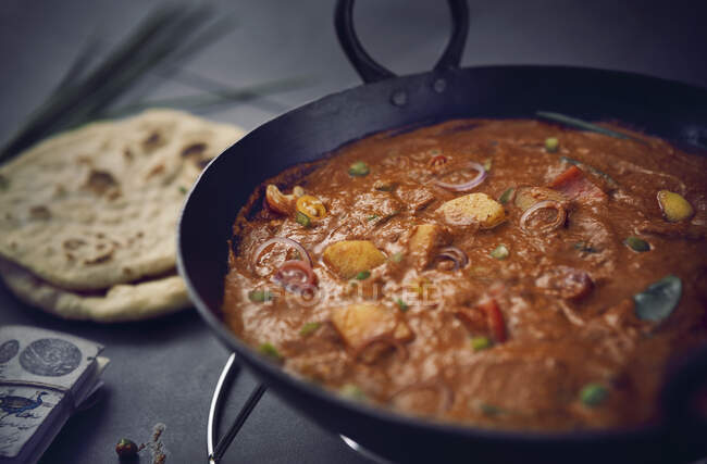 Delicious fried fish stew with meat in the pan — Stock Photo