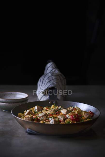 Calamarata pasta with swordfish ragout in the pan — Stock Photo