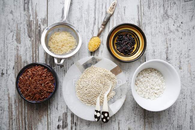 An arrangement of various types of rice, quinoa and couscous (seen from above) — Stock Photo