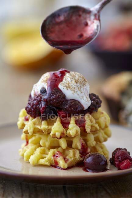 Waffles with berry compote and yoghurt — Stock Photo