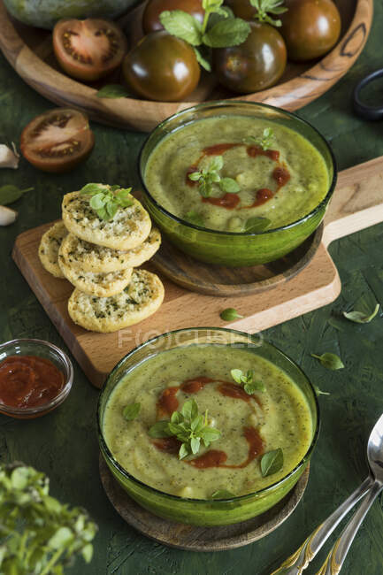 Spicy zucchini soup in glass bowls — Stock Photo