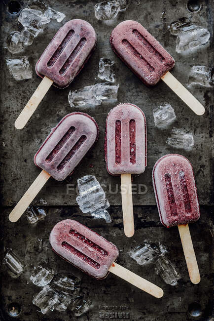 Ice cream on a stick with forest fruit flavor — Stock Photo