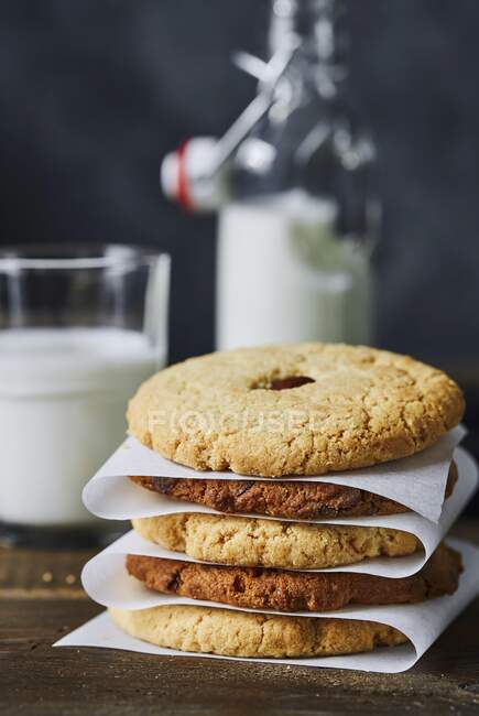 Stack of dark and light almond cookies — Stock Photo