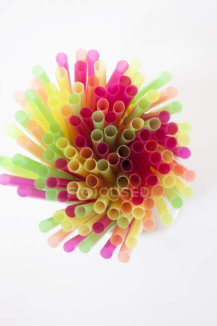 Colorful straws on a white background — Stock Photo