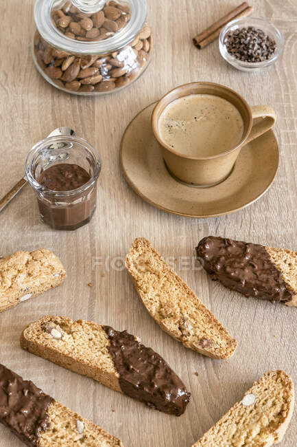 Italian almond cookies cantucci with dark chocolate and coffee — Stock Photo