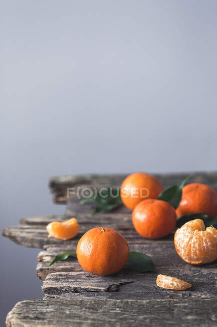 Clementines on a wooden surface — Stock Photo