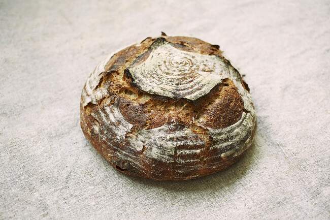 Close-up shot of delicious loaf of sourdough bread — Stock Photo
