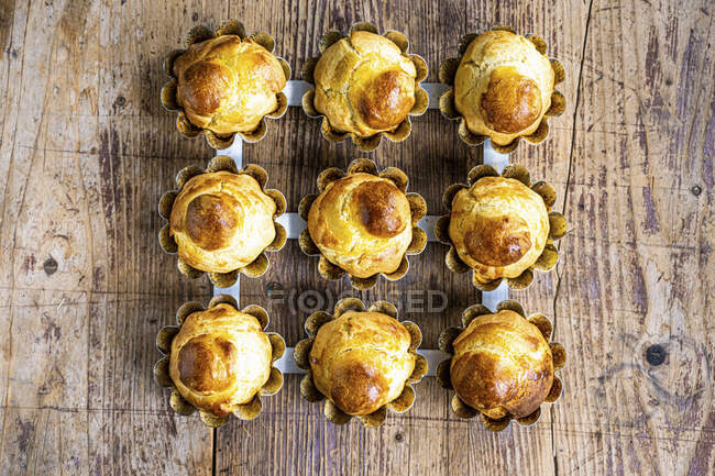 Brioches in baking cases — Stock Photo