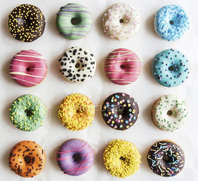 Sweet colorful and glazed American donuts — Stock Photo