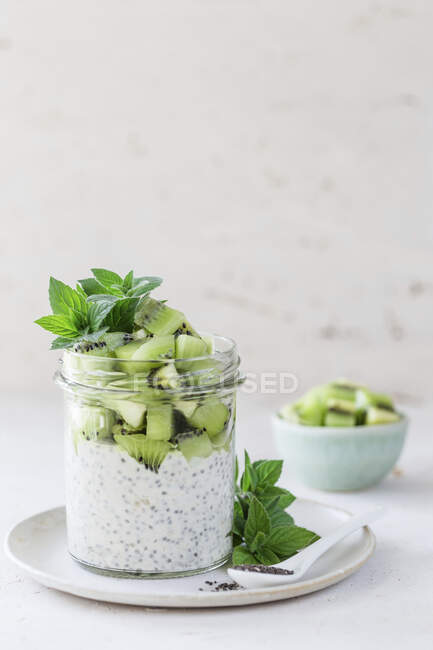 Chia yoghurt with kiwi and mint in jar — Stock Photo