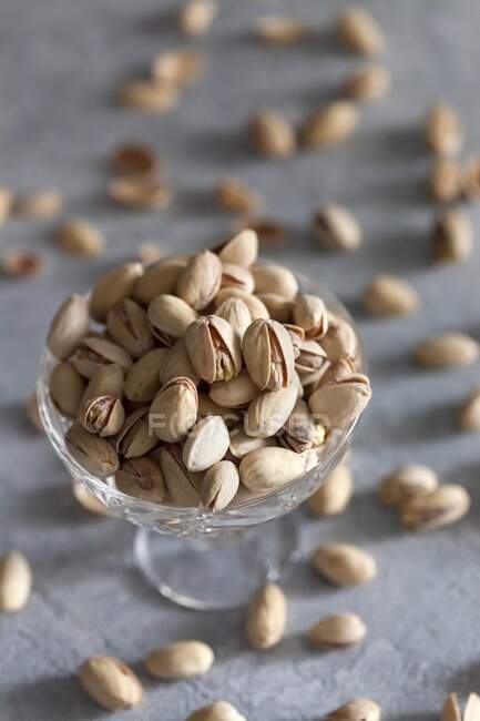 Pistachios in a crystal glass bowl — Stock Photo