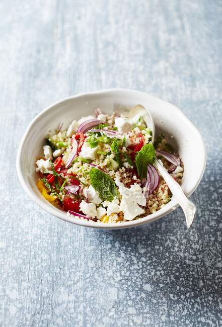 Tabouleh with couscous, vegetables, feta and mint — Stock Photo