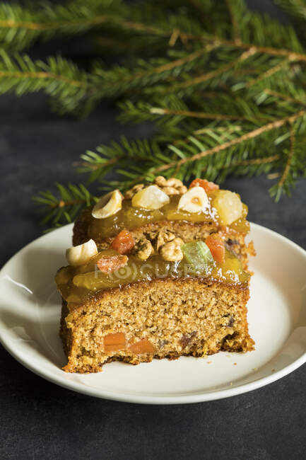 Christmas fruit cake with nuts, spices and sweet fruits — Stock Photo