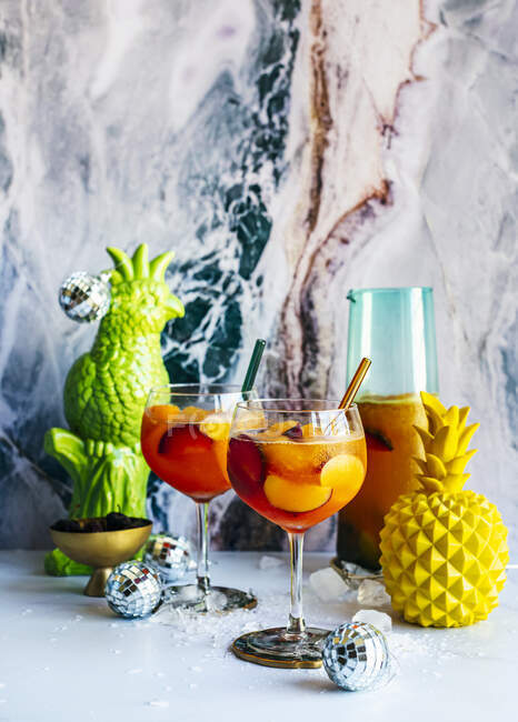 Stone Fruit Sangria in a New Years Eve party setting — Stock Photo