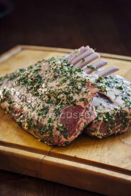 Raw lamb ribs with herbs — Stock Photo