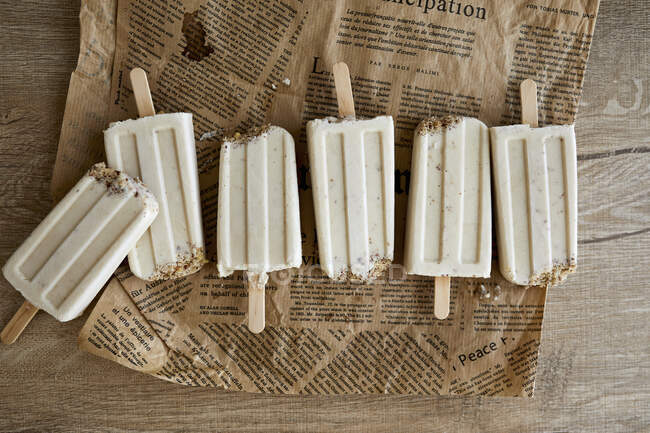 Vegan banana ice cream with almond milk and nuts — Stock Photo