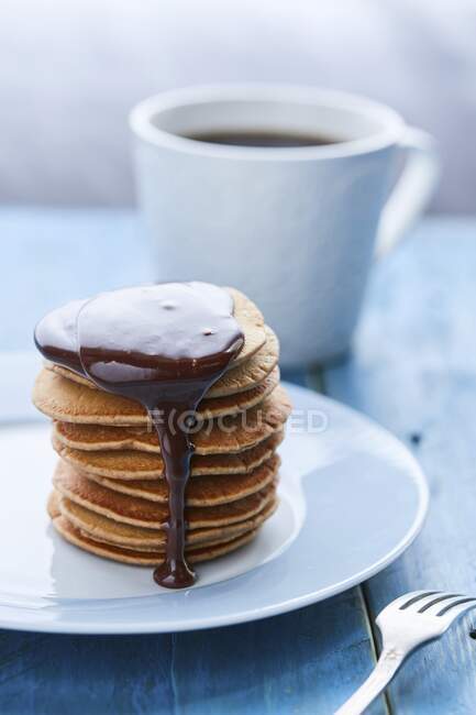 A stack of pancakes with chocolate sauce — Stock Photo