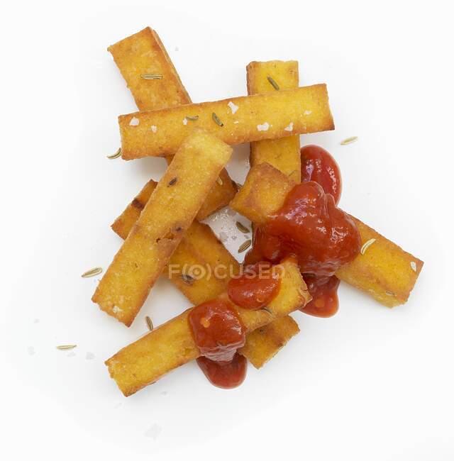 Polenta chips with tomato ketchup (seen from above) — Stock Photo