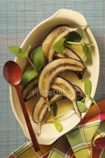 Baked bananas in an oven dish — Stock Photo
