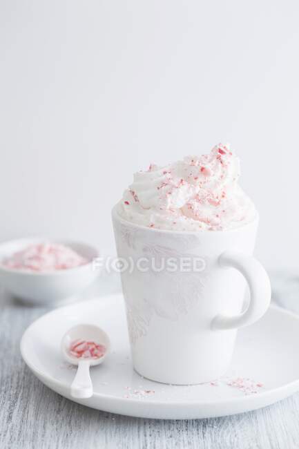 White hot chocolate with candy cane — Stock Photo